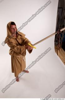 18 2018 01 PAVEL MONK STANDING POSE WITH SWORD AND…